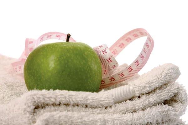 Towel, apple and measuring tape — Stock Photo, Image