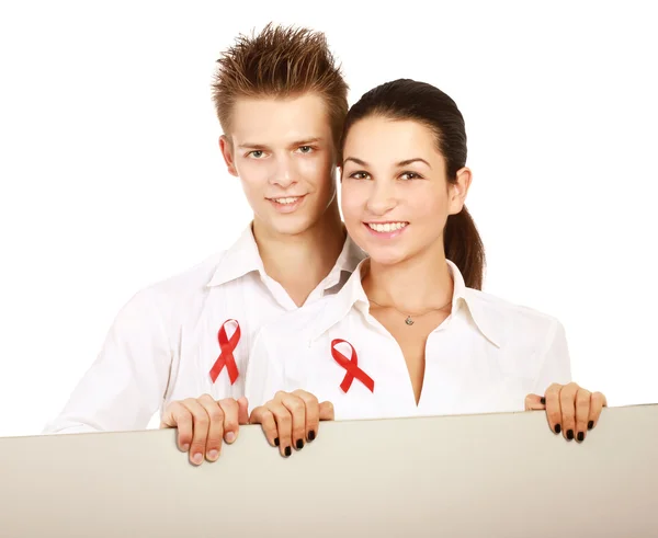 Couple using red for AIDS — Stock Photo, Image