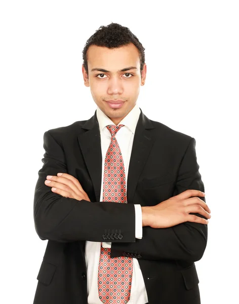 Joven hombre de negocios guapo de pie con los brazos cruzados sobre fondo blanco — Foto de Stock