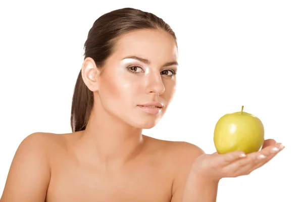 Vrouw met een groene appel — Stockfoto