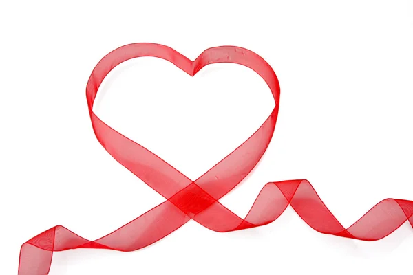 Red ribbon shaping heart — Stock Photo, Image