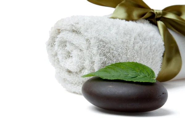 Stone, towel and leaf of mint — Stock Photo, Image