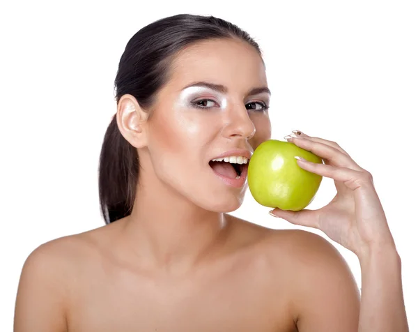 Woman eating green apple Stock Image