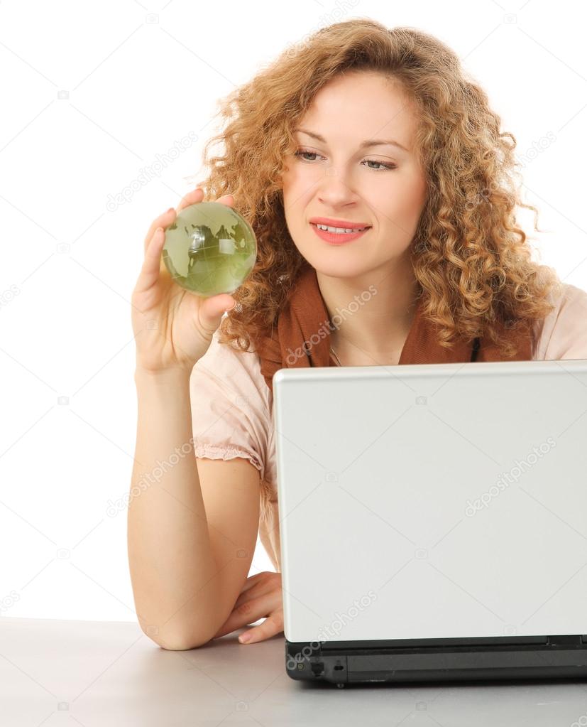 Woman with glass globe and laptop