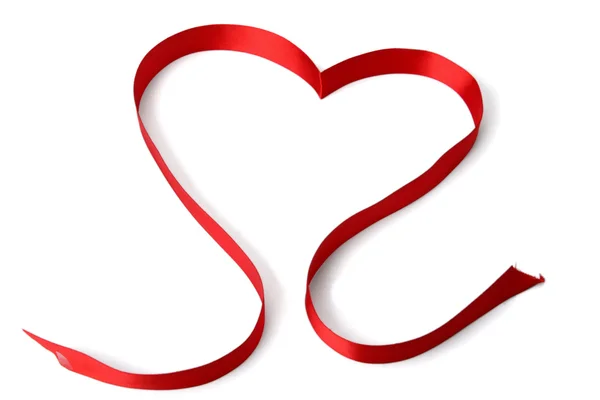 Красная лента, формирующая сердце — стоковое фото