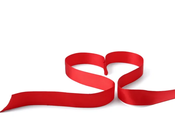 A red ribbon shaping heart — Stock Photo, Image