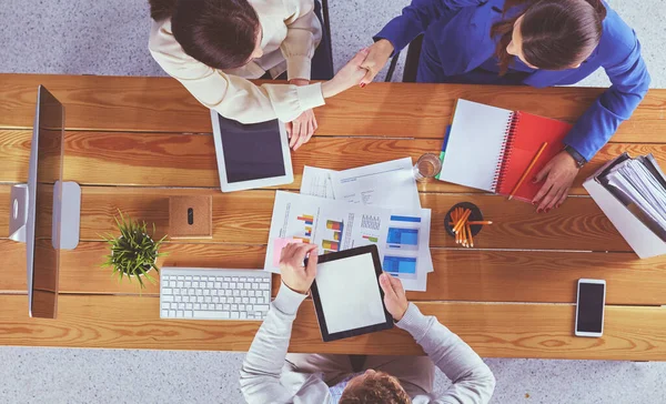 Business people shaking hands during meeting in office — Stock Photo, Image