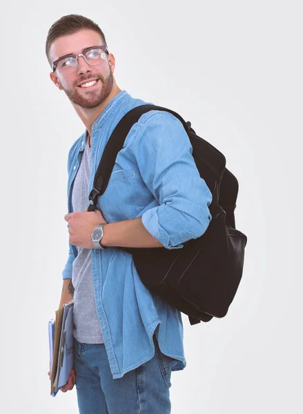 Um estudante do sexo masculino com um saco escolar com livros isolados sobre fundo branco. Oportunidades educativas. Estudante universitário . — Fotografia de Stock