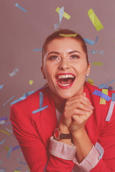 Portreit beautiful happy woman at celebration party with confetti .Birthday or New Year eve celebrating concept