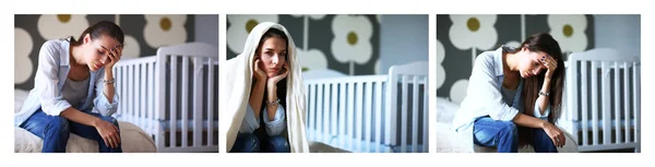 Junge Müde Frau Sitzt Auf Dem Bett Neben Kinderbett — Stockfoto