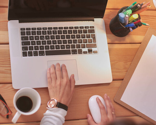 Young female working sitting at a desk