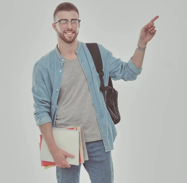 一位男同学书包拿着书在白色背景上分离 教育机会 大学生 — 图库照片