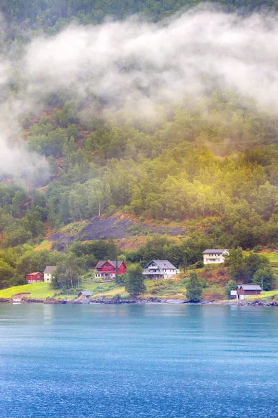 Norwegian old wooden houses and fog in summer, Norway — Stock Photo, Image
