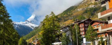Zermatt, Switzerland street view in famous Swiss Alps ski resort, river, snow Matterhorn, banner