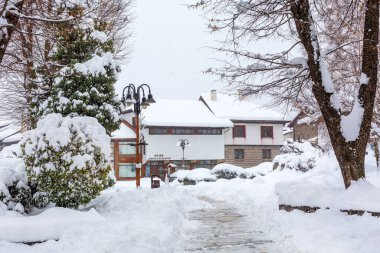 Bansko, Bulgaria - February 2, 2022: Old town centre at Nikola Vaptsarov square and museum, winter view