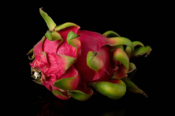 Dragon fruit horizontally on a black background — Stock Photo, Image