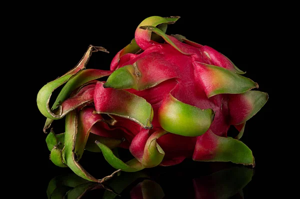 Dragon fruit horizontally rotated on a black background