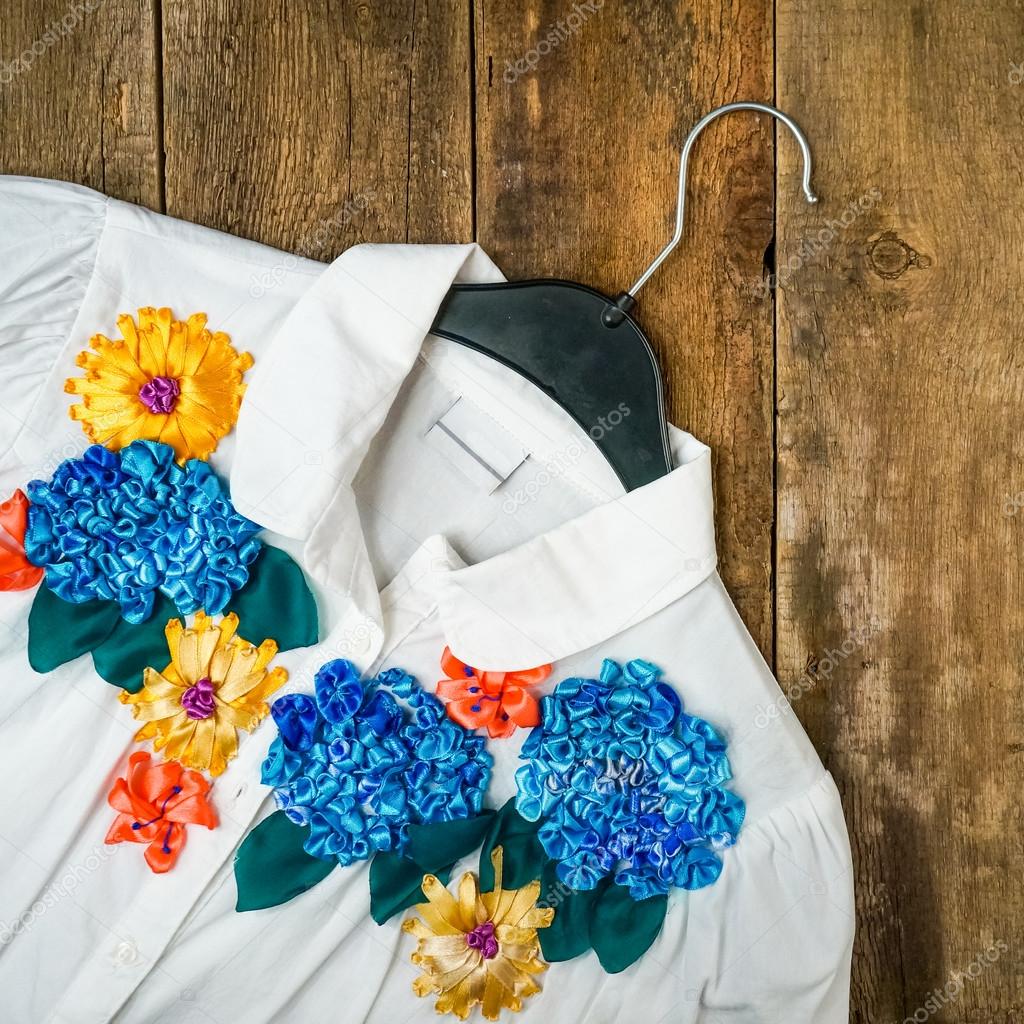 Silk flower embroidery on white blouse