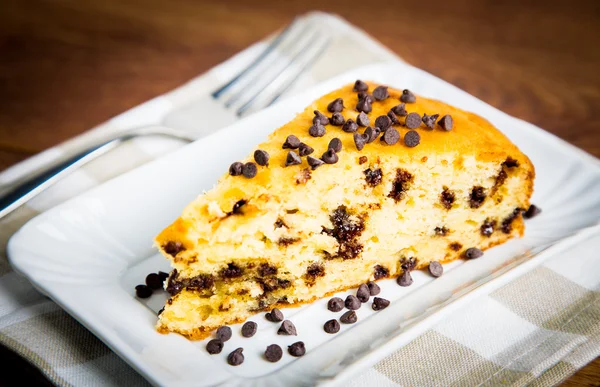 Slice of pears cake with chocolate drops - Stock Image