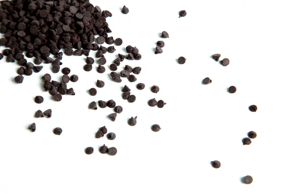 Primer plano de bocados de chocolate aislados en blanco Imagen de stock