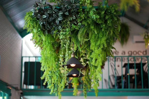 Fake plant hanging decoration. The artificial colorful flowers hanging upside down for interior decoration.