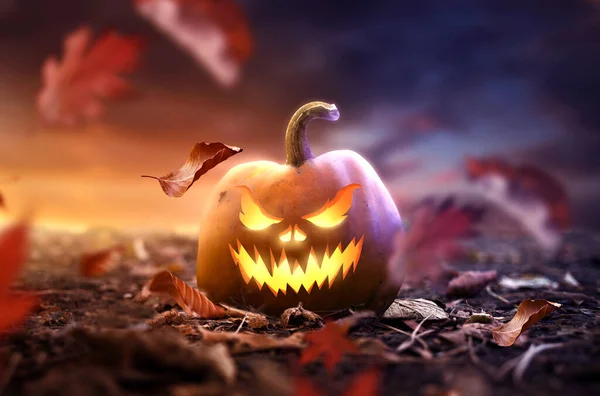 Spooky Glowing Halloween Party Pumpkin Lantern Leaves Blowing Arount Photo — Stock Photo, Image