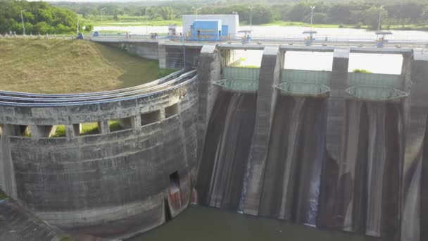 Hydroelectric dam with flowing water through gate, aerial view from drone. Bendungan Sampean Baru in Java, Indonesia — Stock Video