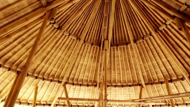 Bamboo roof of the house in Indonesia. roof with bamboo structure of hut or rural house. Design in tropical resort in Asia. Dry plant texture with light gap background — Stock Video