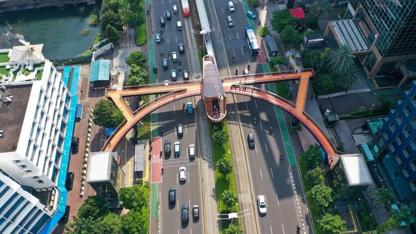 Aerial pedestrian bridge near the bus stop Karet Sudirman known. New icon Jembatan Phinisi in Jakarta city.