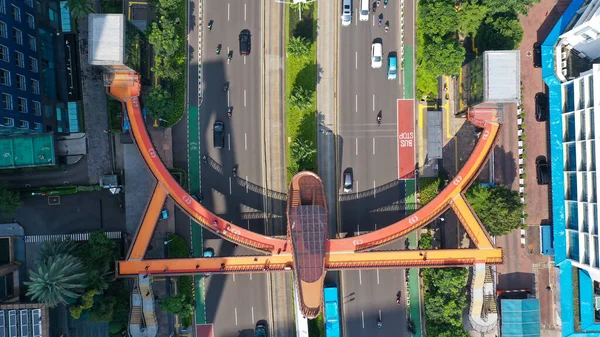 Aerial pedestrian bridge near the bus stop Karet Sudirman known. New icon Jembatan Phinisi in Jakarta city.