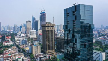 Futuristic design skyscraper. Modern architecture scrapper building on Thamrin Street in Jakarta.