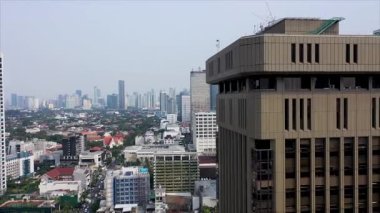 Close up footage of sky scrapers at sunset in Jakarta.