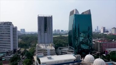 Beautiful aerial view of Jakarta city with skyscrapers and light rail transit track construction. Shot in 4k resolution.