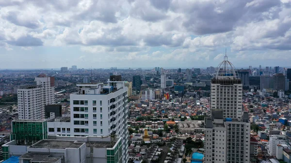 Aerial view of Asia Business concept for real estate - panoramic modern cityscape building bird eye aerial view under sunrise and morning blue bright sky in Jakarta. Jakarta, Indonesia.