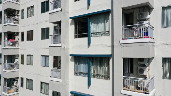 Close-up view of balconies of modern high rise apartment building.