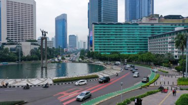 Busy traffic at Monumen Bundaran Hi, Jakarta, indonesia.
