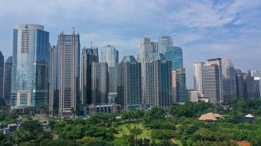 Rows of high-rise buildings are immortalized from a height in Jakarta.