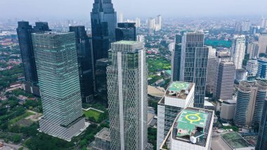 Rows of high-rise buildings are immortalized from a height in Jakarta.