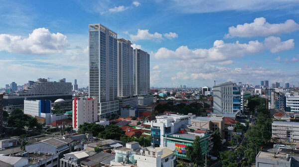Aerial Photography with Camera drone landscape of Jakarta city blue sky with skyscrapers.