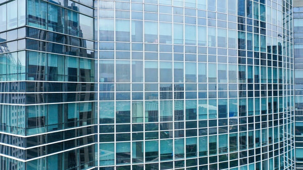 Glass wall of modern industrial building, may be used as background.