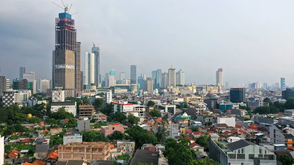 A bird eye view of high-density neighborhood in Jakarta . Jakarta, Indonesia\'s massive capital, sits on the northwest coast of the island of Java.