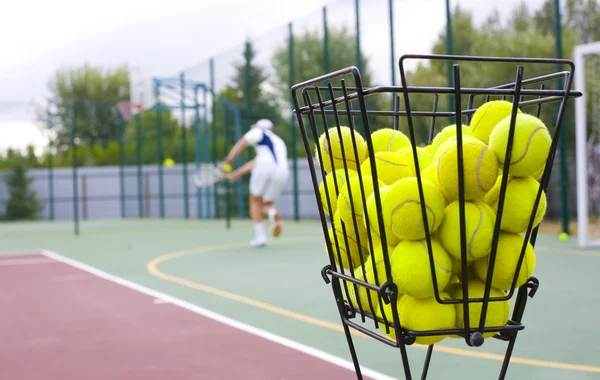 Basket for tennis balls — Stock Photo, Image