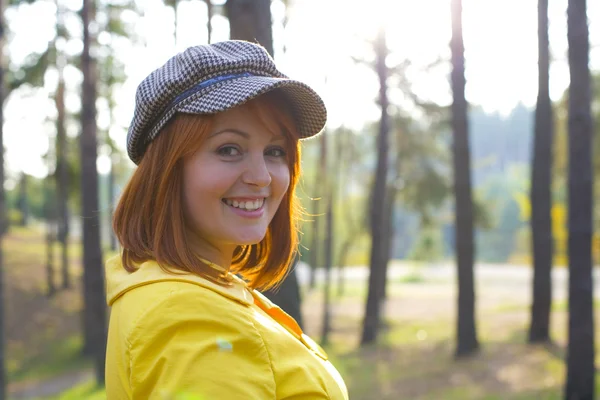 Attractive red-haired girl in the autumn wood — Stock Photo, Image