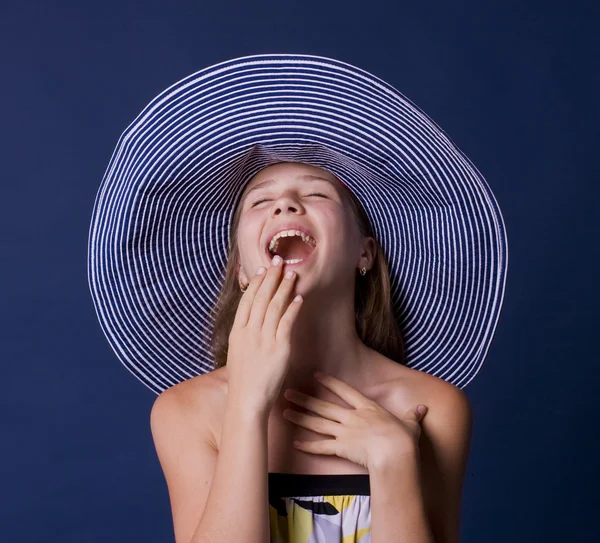 Portrait of the laughing girl in a hat — Stock Photo, Image