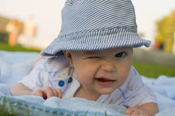 Amusing kid winks — Stock Photo, Image