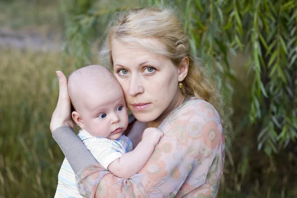Young mother-blonde with baby — Stock Photo, Image