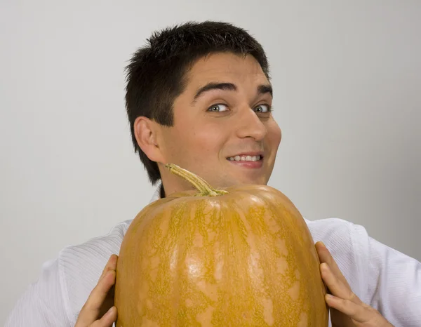 Portrait of the guy with a pumpkin — Stock Photo, Image