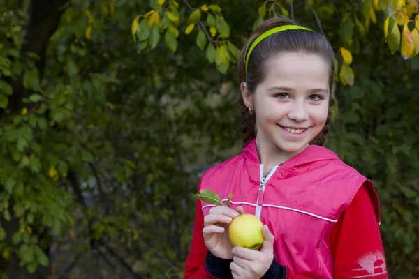 Portrait of the girl with plaits apple — Stock Photo, Image