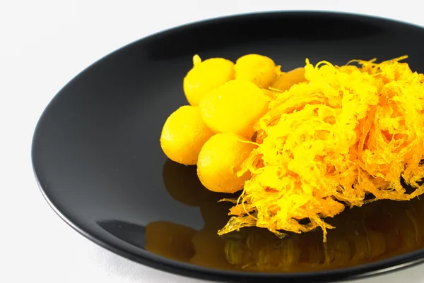 Gold egg yolks drops and Pinched gold egg yolks — Stock Photo, Image