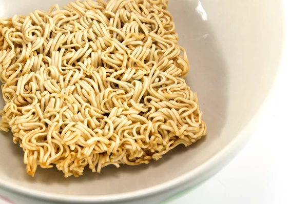 Dry instant noodle in a bowl — Stock Photo, Image
